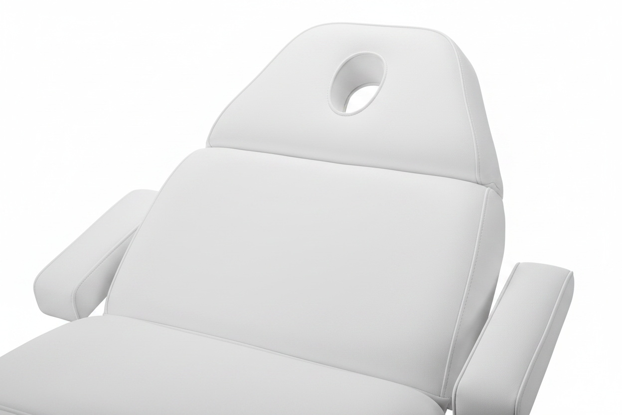 Close-up of Adore Electric Beauty Bed showing white PU leather upholstery, headrest with breathing hole, and arm support